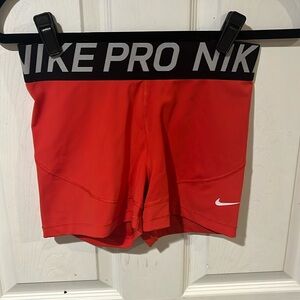 red nike pros
size medium